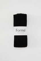 The Studio Grip Warmer in Onyx, folded with the Formé band