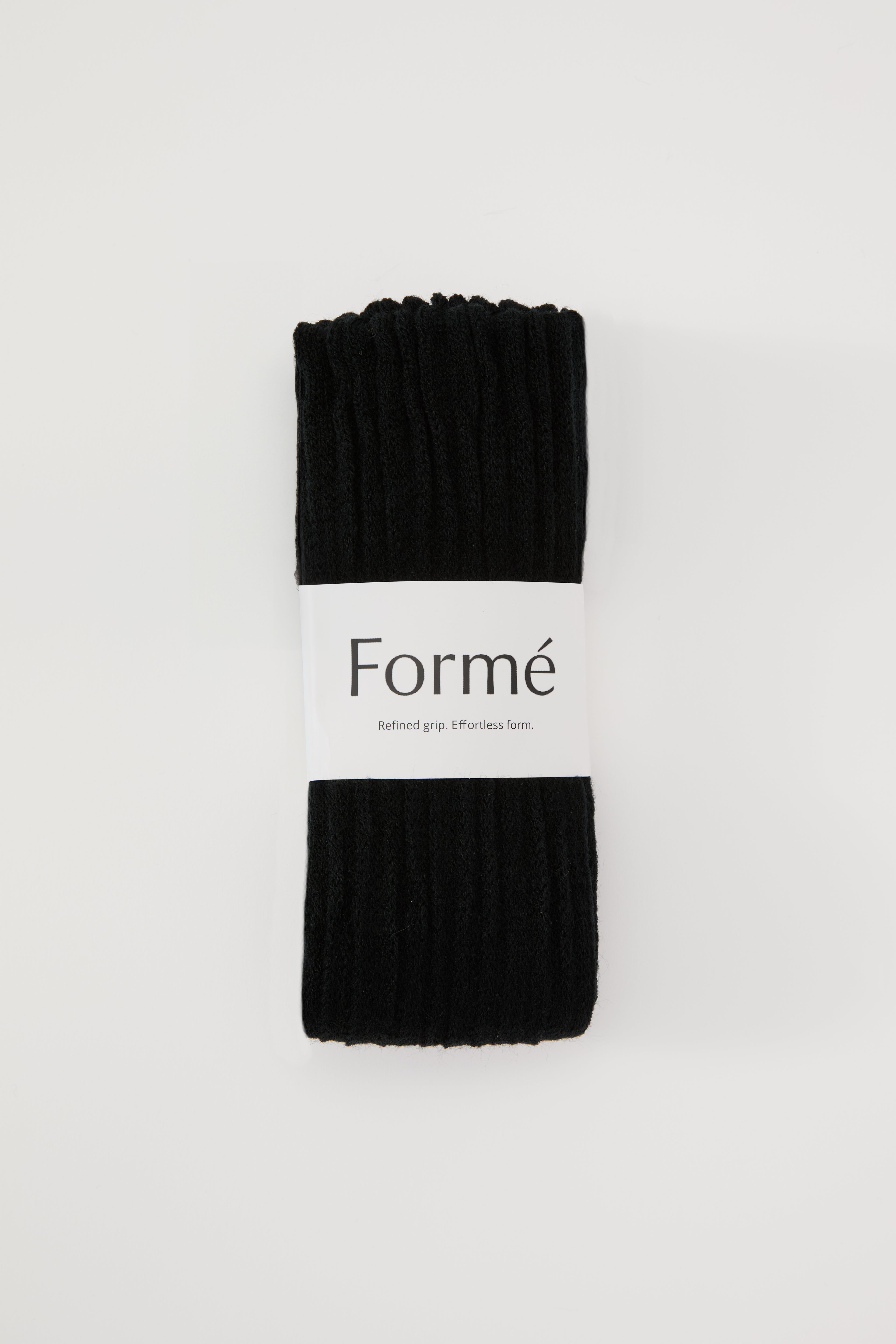 The Studio Grip Warmer in Onyx, folded with the Formé band