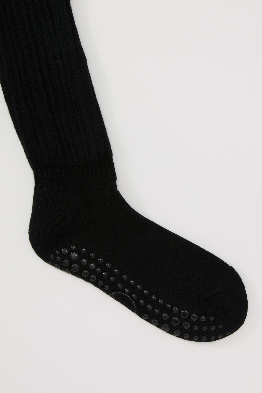 The Studio Grip Warmer in Onyx, ankle and grip sole detail
