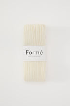The Studio Grip Warmer in Ivory, folded with the Formé band