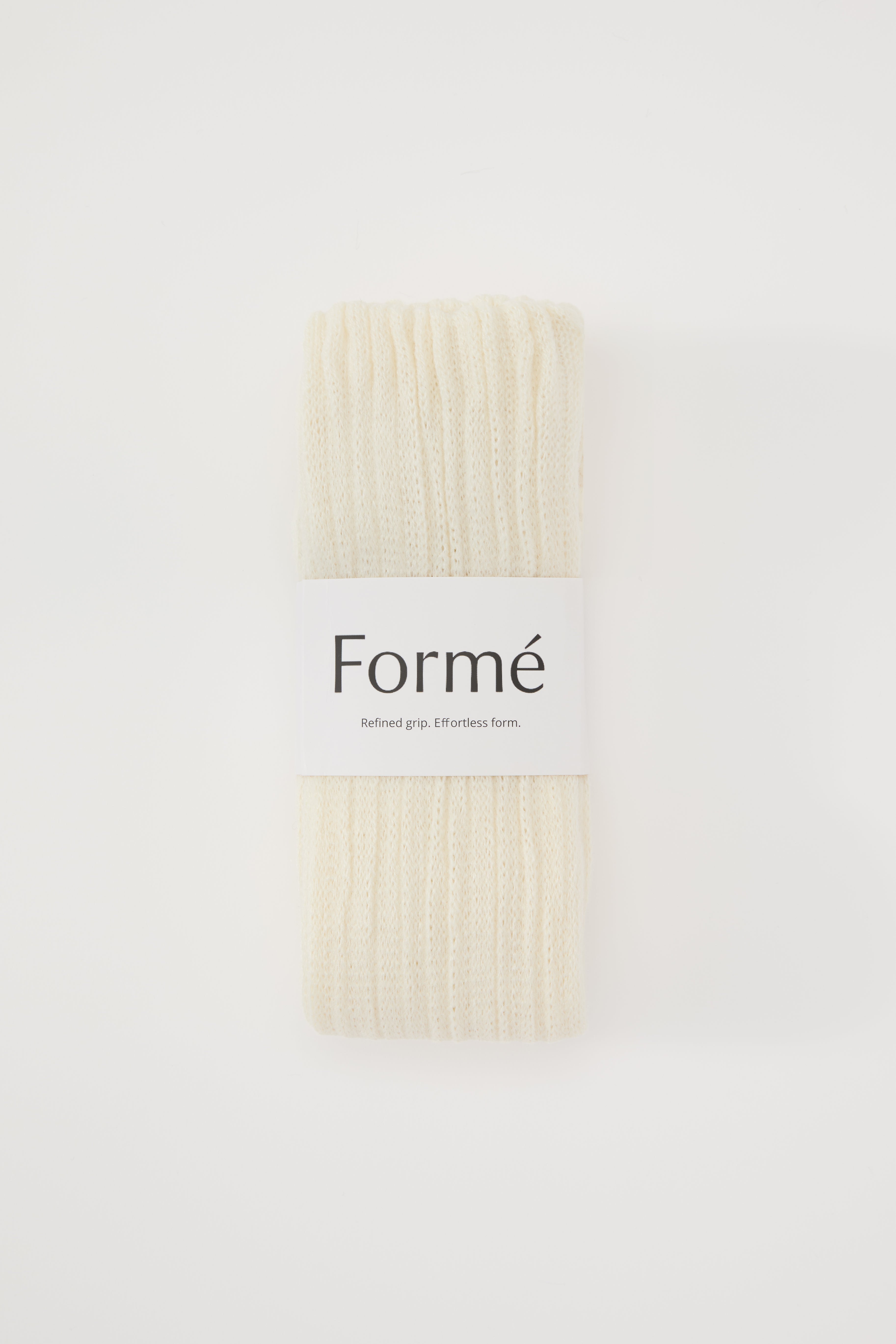 The Studio Grip Warmer in Ivory, folded with the Formé band