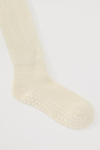 The Studio Grip Warmer in Ivory, ankle and grip sole detail