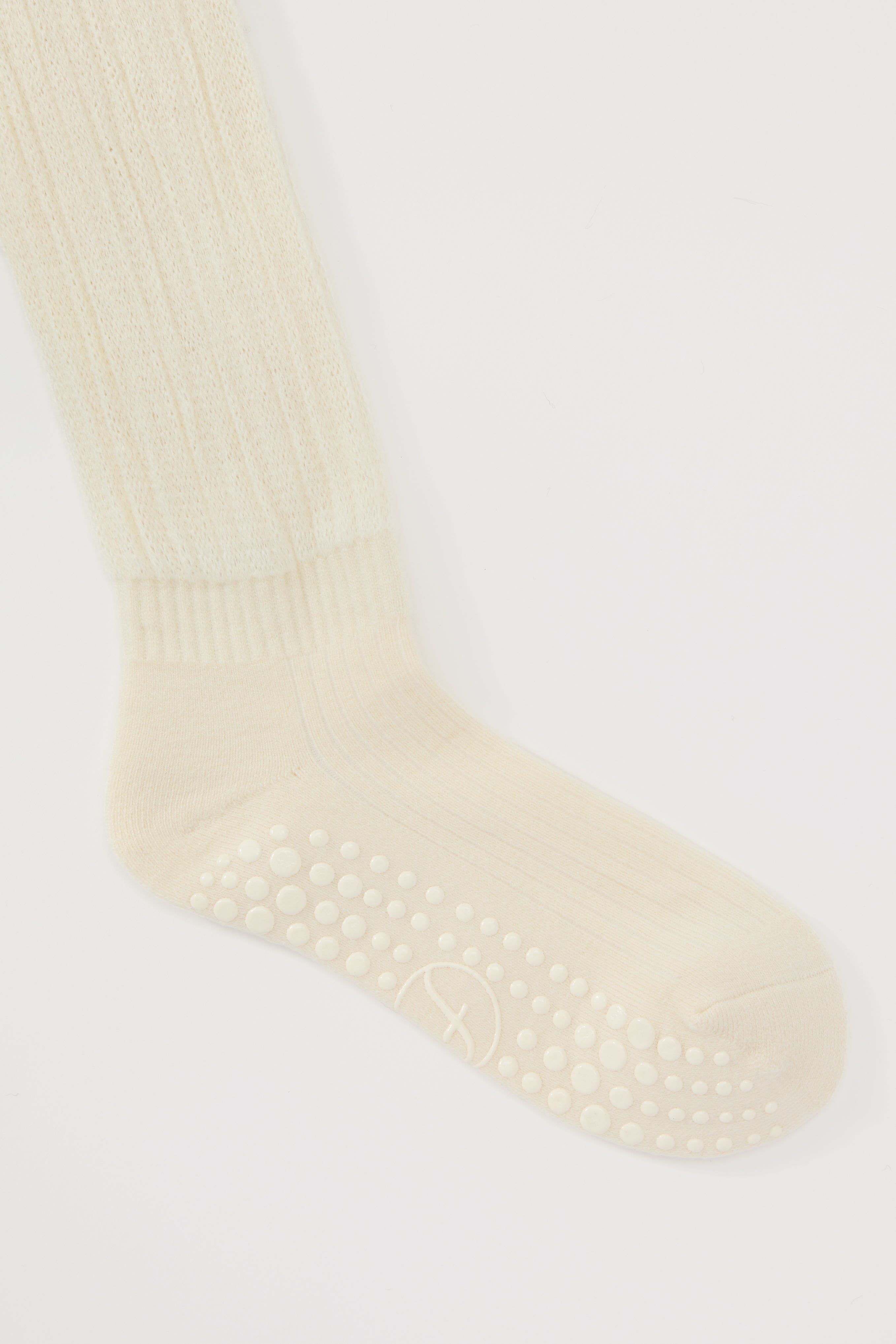 The Studio Grip Warmer in Ivory, ankle and grip sole detail