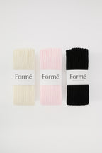 The Complete Set, three pairs in Ivory, Blush, and Onyx folded with Formé bands