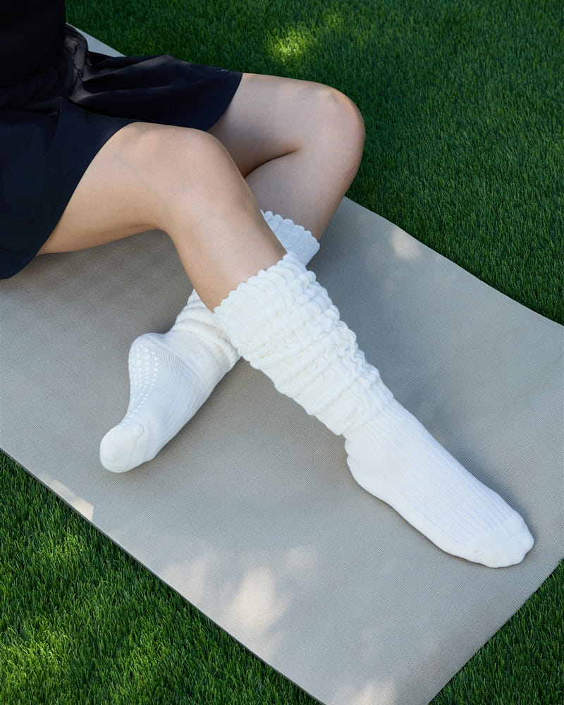 The Studio Grip Warmer in Ivory worn softly slouched at the ankle